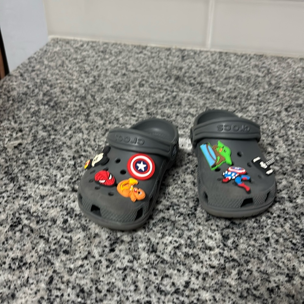 Gray crocs with charms size 9c